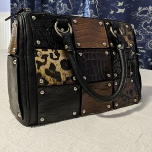 Animal print, studded black top handle bag